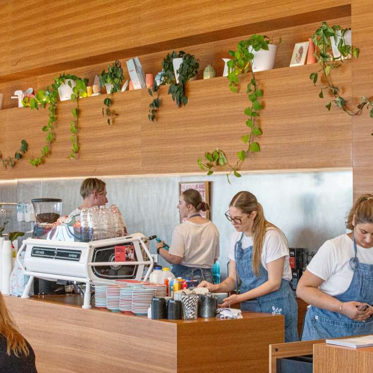 Staff serving behind the counter