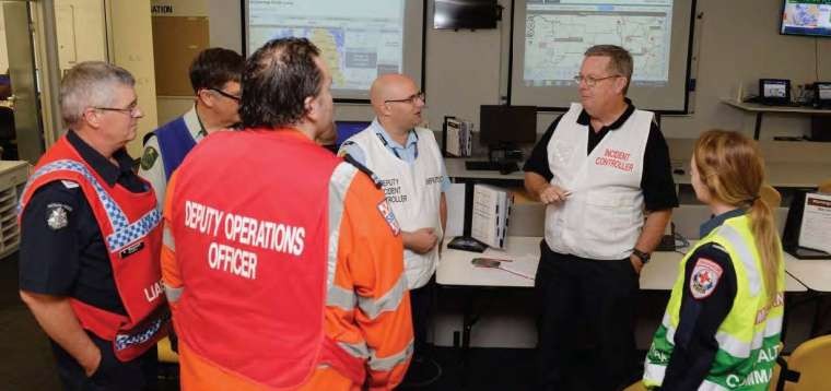 The Municipal Emergency Management Team meeting in the control room. Photo courtesy of Ray Sizer.