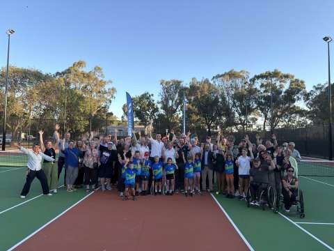 The crowd at the opening event poses for a group photo
